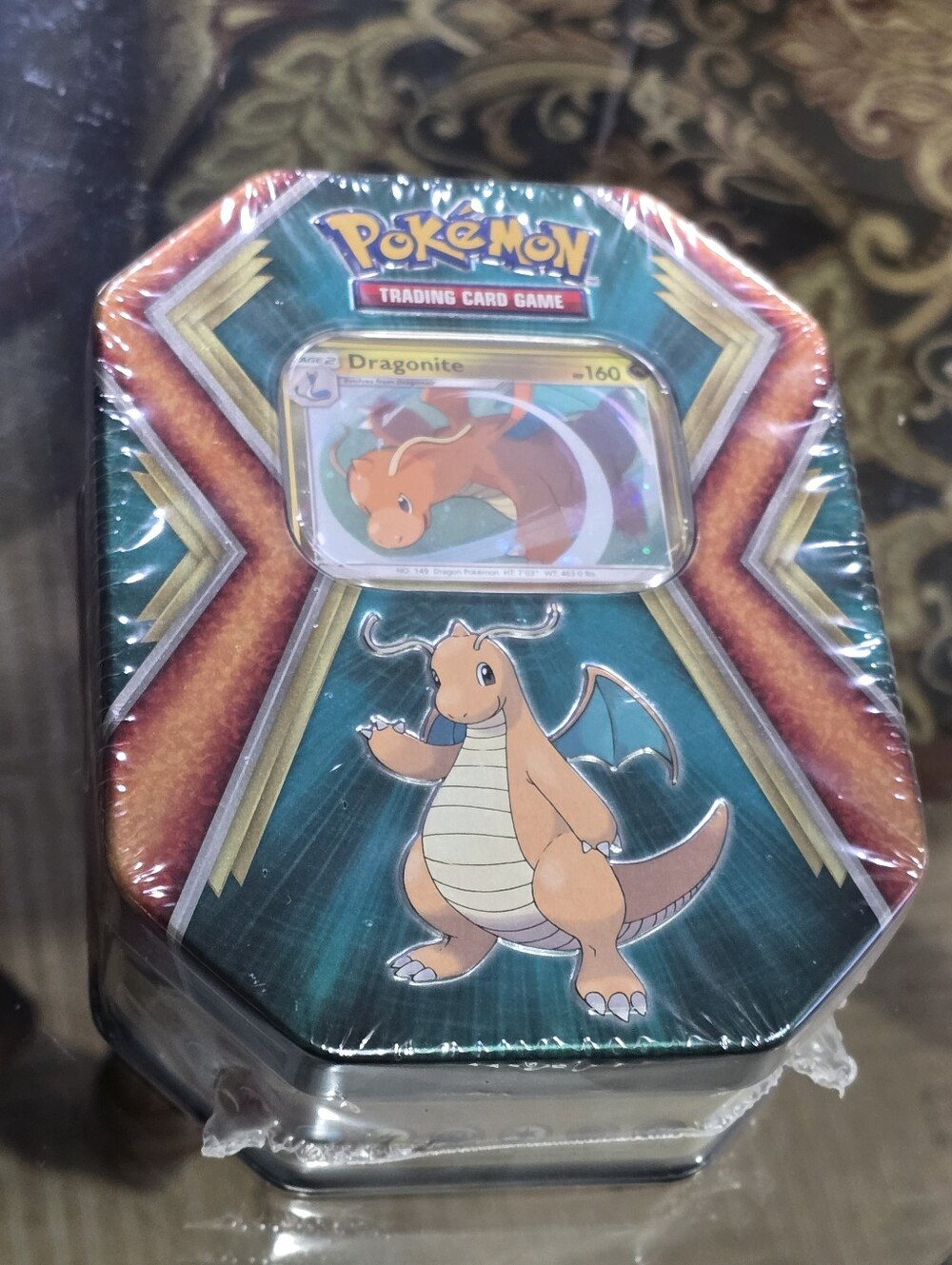 Dragonite Collectible Card Game Tin - Orange/Teal